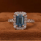 Blue Emerald Cut Lab Grown Diamond Halo with Pave Engagement Ring