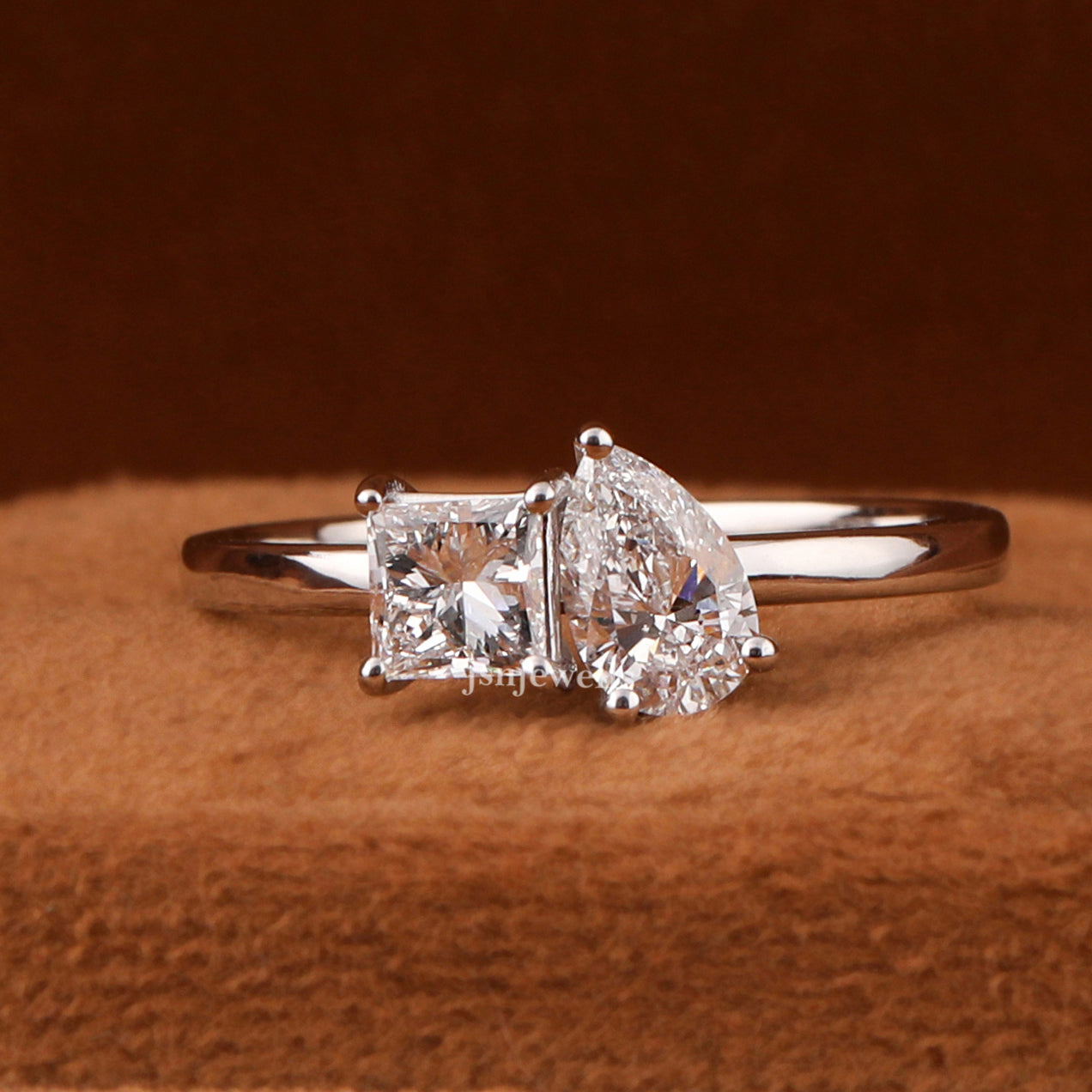 Elegant Pear Shaped Engagement Ring Featuring Princess Cut Diamond
