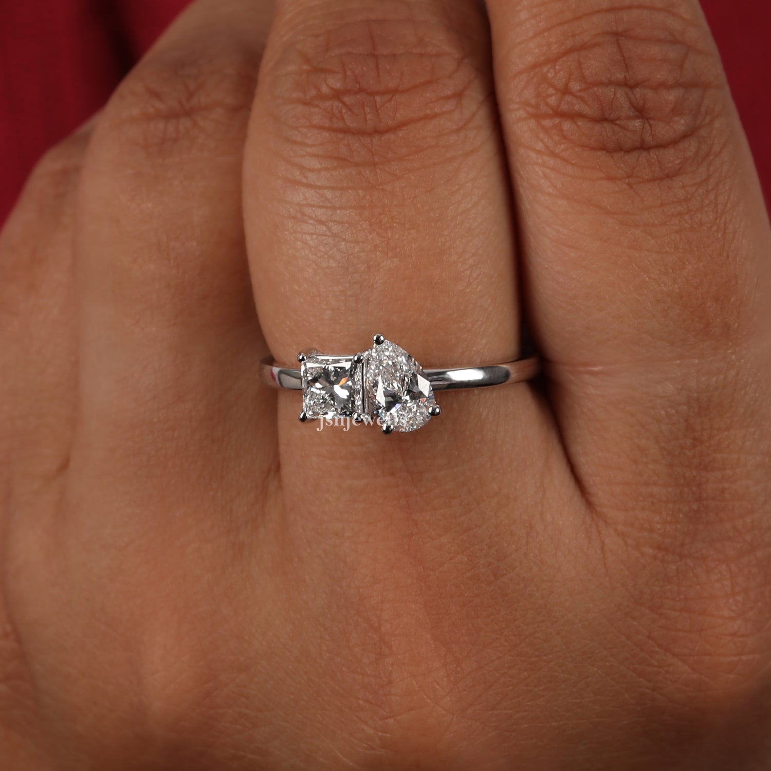 Elegant Pear Shaped Engagement Ring Featuring Princess Cut Diamond